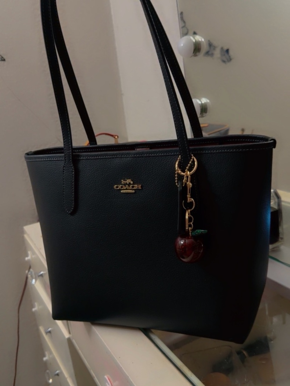 Coach Black Leather Tote Medium Size charm is not included..